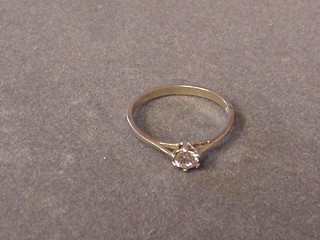 A diamond solitaire engagement ring