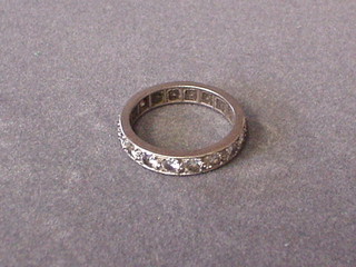 A lady's white gold or platinum full eternity ring set diamonds