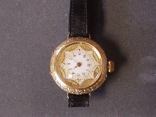 A lady's wristwatch with enamelled dial contained in a 18ct chased gold case