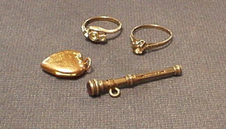 2 silver rings, a gilt locket and a propelling pencil