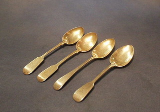 A George III silver fiddle  pattern pudding spoon, London 1836 and 3 Victorian silver fiddle pattern pudding spoons, 5 ozs 