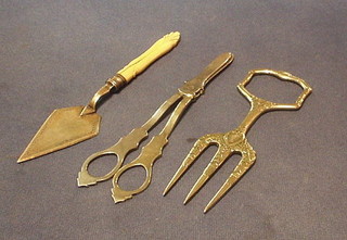 A pair of silver plated grape scissors, a do. bread fork and do. butter trowel