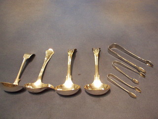 A pair of Georgian silver Old English pattern sugar tongs, 2 others and 4 silver plated sauce ladles