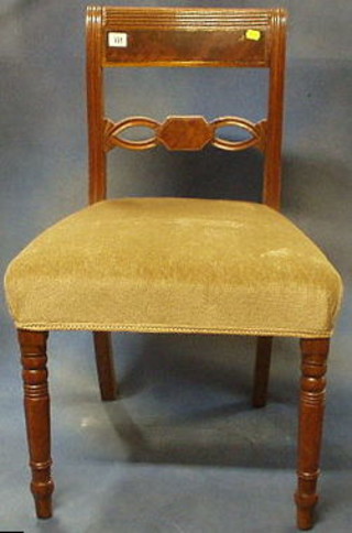 A pair of Regency mahogany bar back dining chairs with pierced mid rails and upholstered seats on turned supports