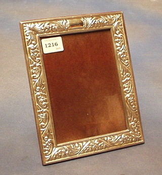 A modern embossed silver easel photograph frame 9" x 7"