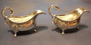 2 large silver plated sauce boats with gadrooned borders and C scroll handles