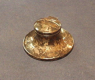 A silver capstan inkwell, Birmingham 1919, the top with pen rest 3"