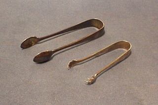 A pair of silver sugar tongs