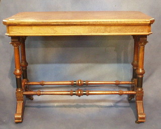 An aesthetic movement lozenge shaped walnutwood card table, raised on 4 carved column supports with Corinthian capitals and H framed stretcher and scrolled supports 38"