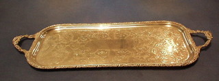 A rectangular silver plated bottle tray with engraved decoration