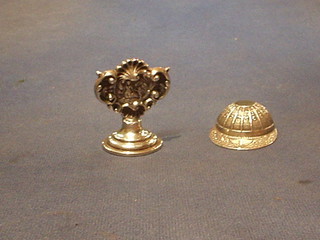 A Continental silver caddy spoon in the form of a jockey's cap and a silver menu card holder