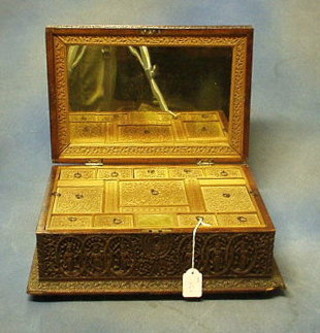 An Indian carved hardwood vanity case, the interior fitted a mirror and several compartments 15" (slight chip to base)