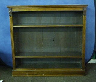 A Victorian walnutwood open bookcase fitted adjustable shelves, 48"