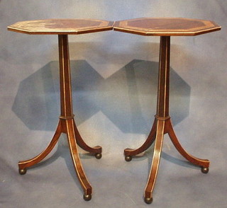 A pair of Georgian style octagonal inlaid rosewood and cross-banded wine tables, raised on a chamfered column and tripod supports 18"