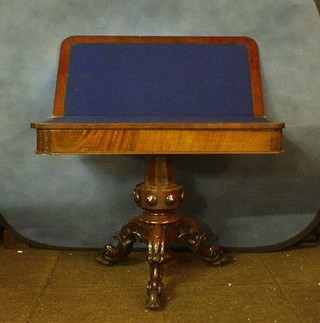 A Victorian D shaped card table, raised on a chamfered column and tripod supports 40"