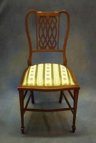 An Edwardian inlaid mahogany splat back bedroom chair with pierced splat back and upholstered seat, on tapering supports