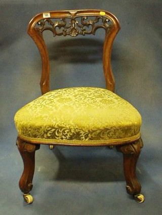 A Victorian pierced mahogany spoon back  nursing chair