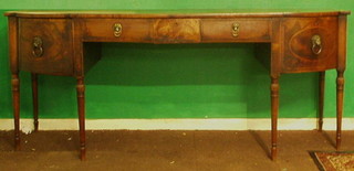 A handsome Irish Georgian mahogany  bow front sideboard, fitted 2 long drawers with brass lion mask drop handles and with 2 deep drawers to the sides, raised on turned supports 90"