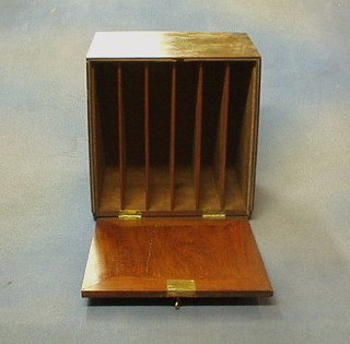 A 19th Century mahogany cabinet with fall front and shelved interior, raised on bun supports 10"