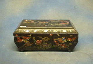 An Oriental lacquered box with hinged lid