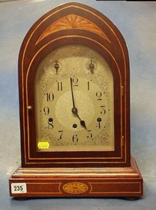 An Edwardian 8 day chiming bracket clock with silvered dial, strike chime indicator, contained in a mahogany lancet case