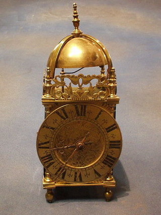 A reproduction 17th Century brass lantern clock, striking on a bell with carriage clock movement by Richard Martin of Wolverhampton