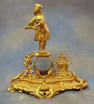 A 19th Century gilt metal clock case in the form of a standing girl with laurel leaf