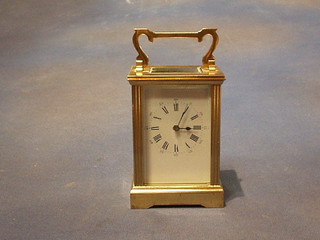 A 19th Century French 8 day carriage clock with enamelled dial and Roman numerals