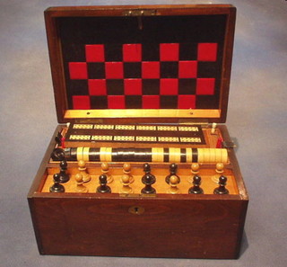 A Victorian mahogany games compendium comprising chess set, drafts, cribbage board, cards, counters etc, etc, all contained in a mahogany box with hinged lid 12" 