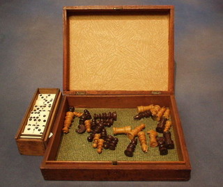 A Victorian box containing a wooden chess set and a set of dominoes