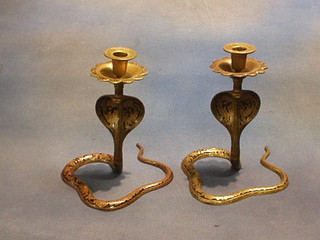 A pair of Benares brass cobra candlesticks 8"