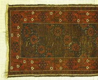 A Belouch rug with blue ground and multi-row borders 63" x 34" (holed)