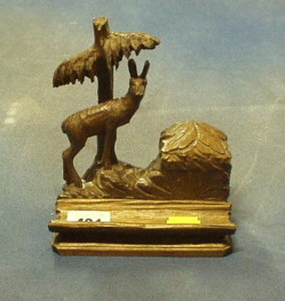 An Austrian carved wooden inkwell decorated a mountain goat