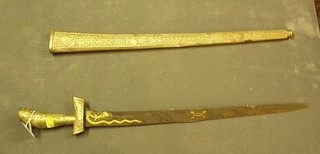 An Eastern Kris dagger contained in an embossed "silver" scabbard