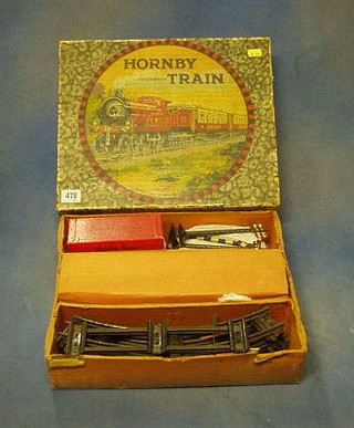 A Hornby O gauge clock work train set with 2 telegraph poles and 2 signals, boxed