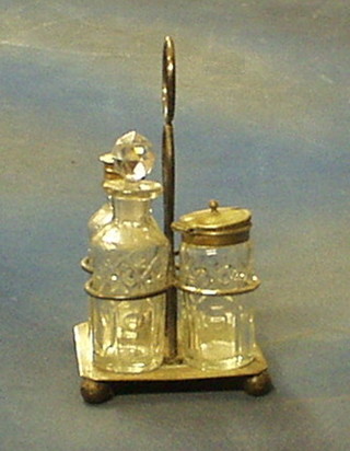 A silver plated cruet frame with 3 glass bottles