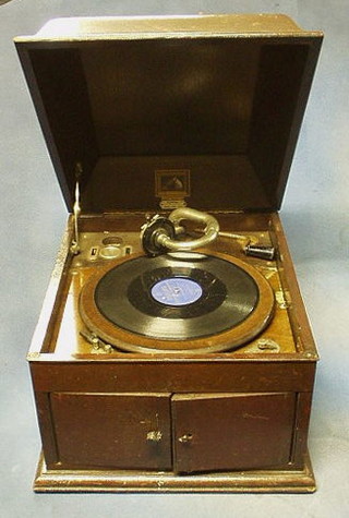 A His Master's Voice model 103 gramophone contained in an oak case