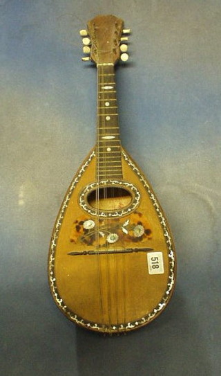 An 8 stringed mandolin by Ferrari & Co