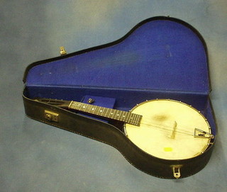 An 8 string banjo with 11" metal drum, contained in a fibre case