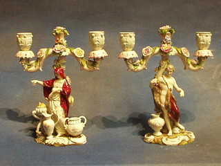 A pair of 19th Century Continental porcelain twin light candelabrum supported by classical figures 9"