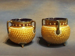 A pair of circular Royal Doulton gilt glazed 3 handled jardinieres 7"
