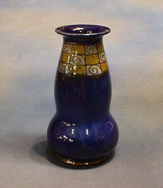 A Doulton blue glazed waisted club shaped vase, the base marked Royal Doulton and impressed 7409E 9"