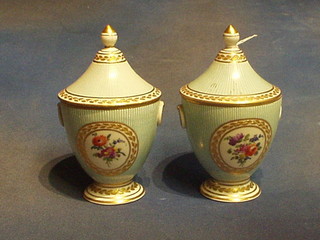 A pair of 19th Century "Sevres" porcelain urns and covers with turquoise and white striped decoration, having oval panels decorated flowers, 8" (r)