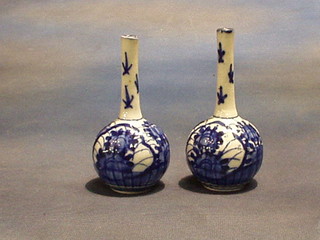 A pair of 19th Century Oriental blue and white bottle vases 5"