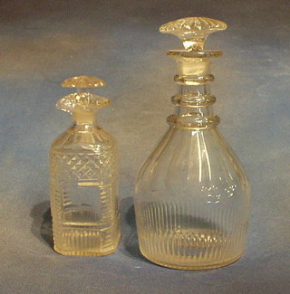 A Georgian panel cut ring neck decanter and stopper (stopper f) and a Georgian panel cut spouted decanter and stopper (2)