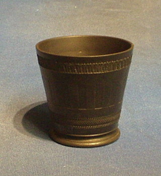 A Wedgwood black basalt beaker, the base marked Wedgwood and incised 24.3.15  3 1/2"