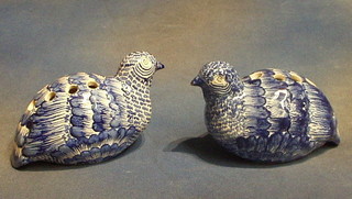 A pair of blue and white pottery vases in the form of seated grouse 8"