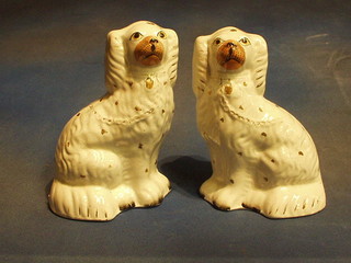 A pair of 19th Century Staffordshire figures of seated Spaniels 10"