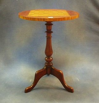 A 19th Century circular mahogany wine table the top inlaid a chessboard, raised on pillar and tripod supports 20"