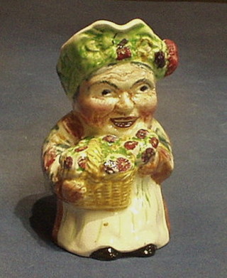 A Shorter Pottery Toby jug "The Flower Seller"